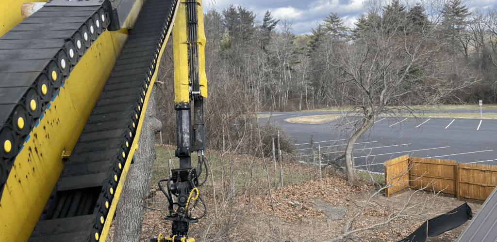 Yellow crane boom on the PV Tree Service crane truck